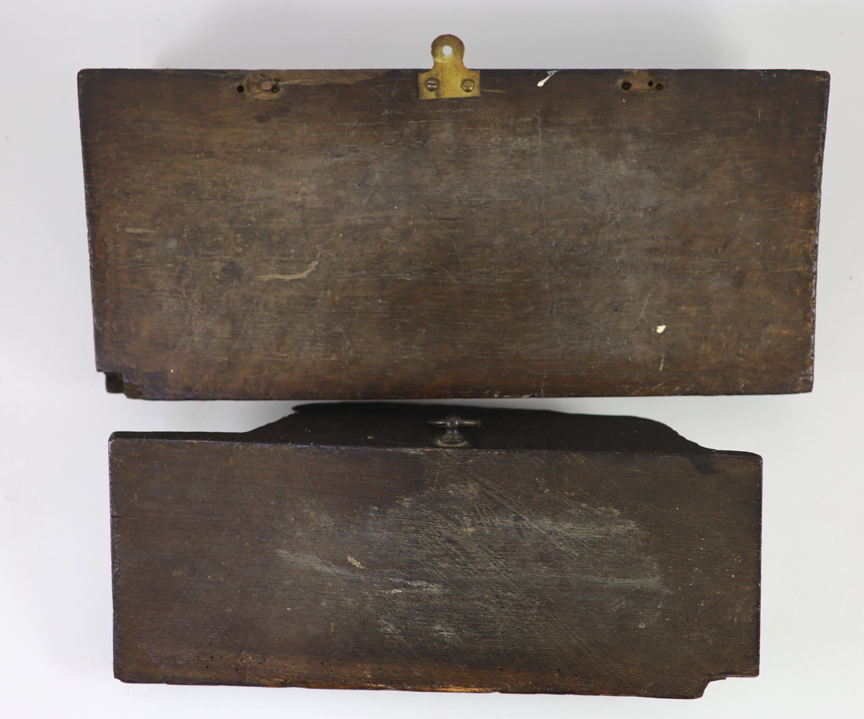 Two carved oak misericord panel fragments, 15th/16th century, the longest 40 x 17cm.